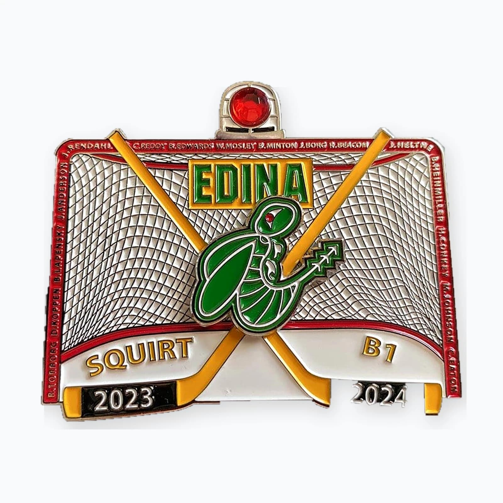 An Edina Squirt B1 trading pin shaped like a hockey net with crossed sticks